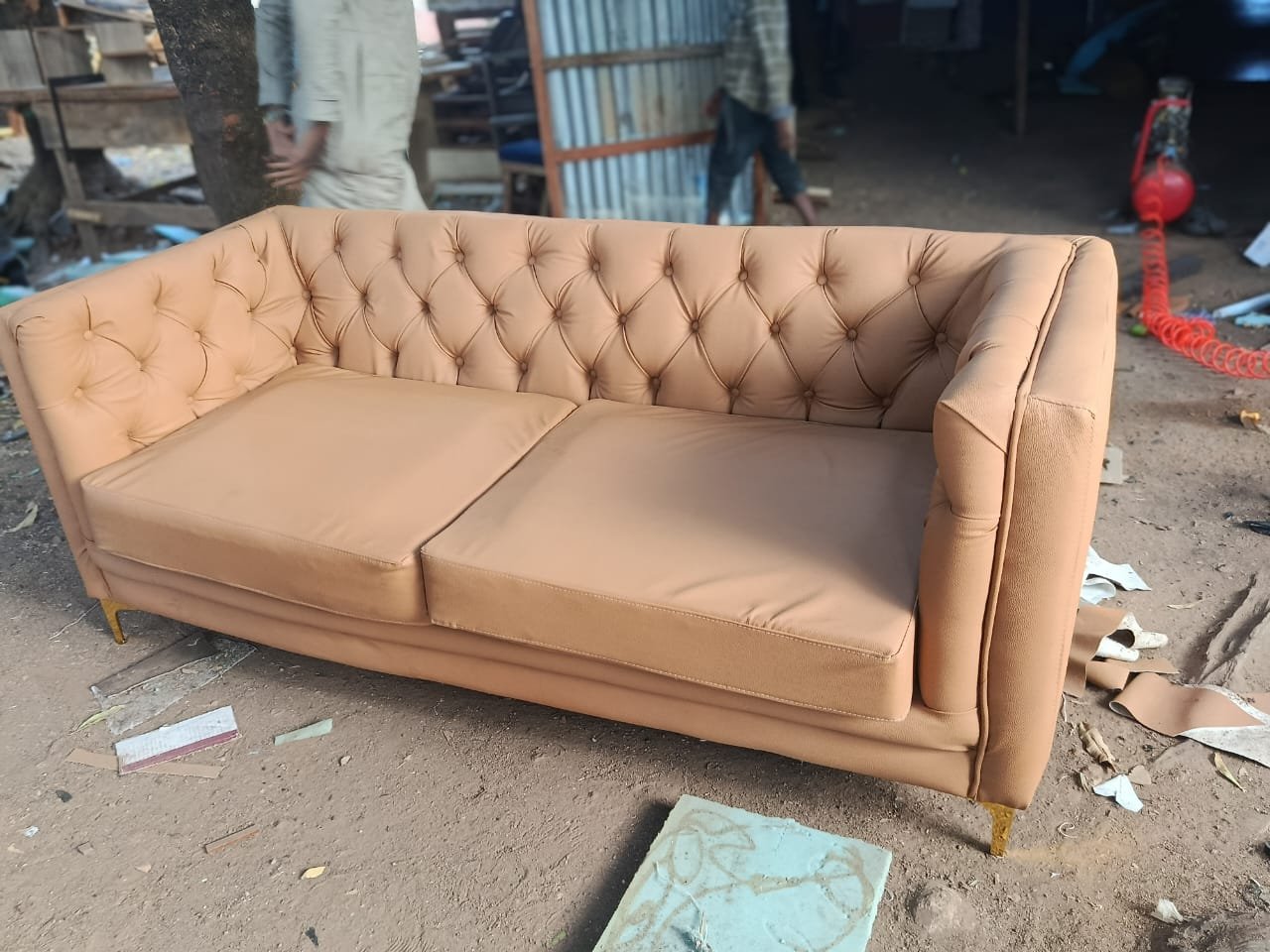 Classic tan tufted leatherette 3-seater sofa