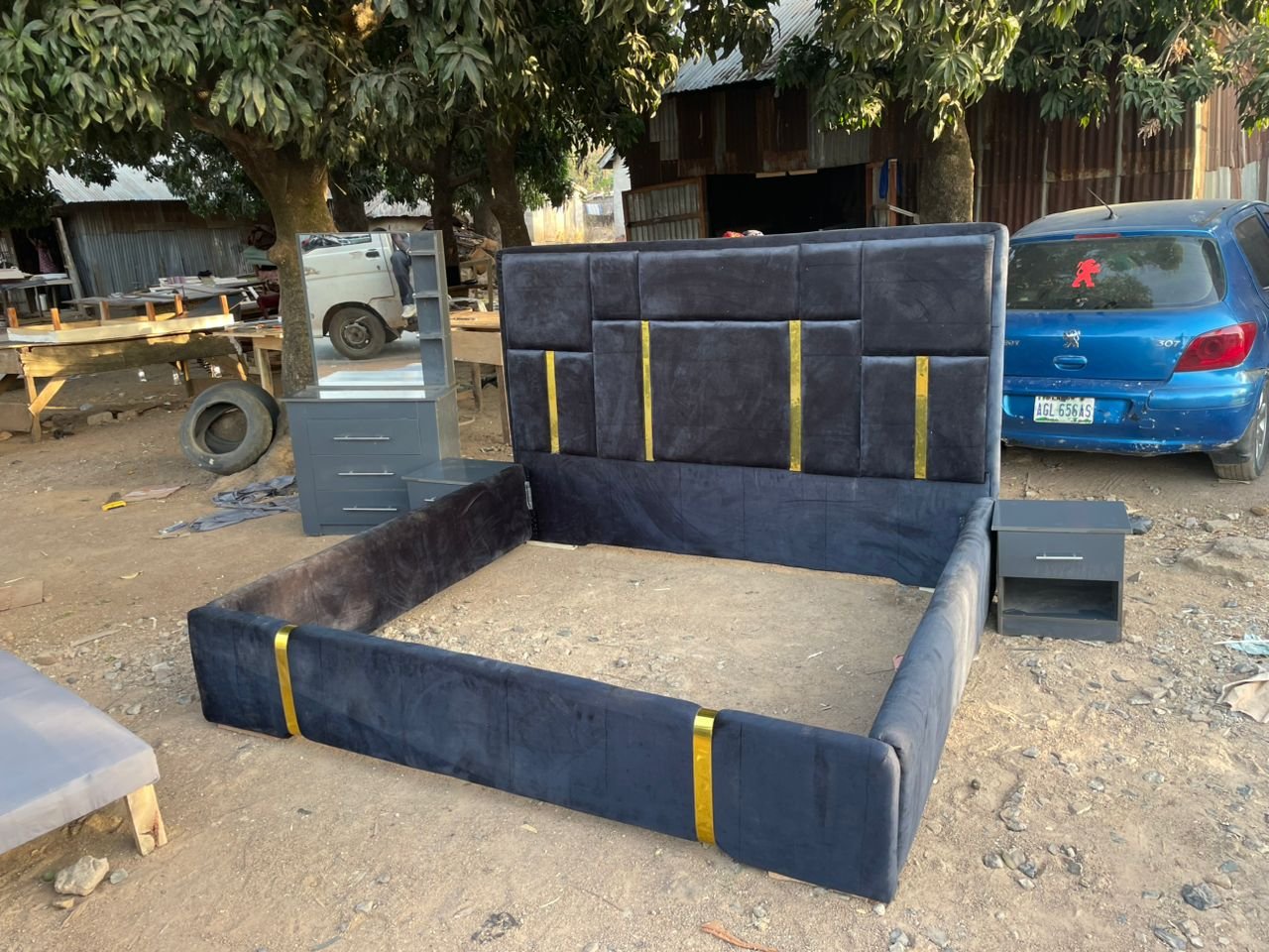 Royal navy blue velvet bed frame with gold accents