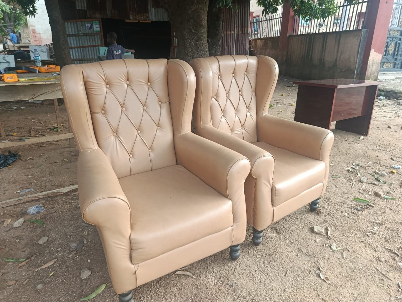 Vintage tufted tan wingback armchairs (pair)